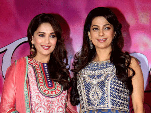 Bollywood actress Madhuri Dixit with Juhi Chawla during a promotional event of her upcoming movie Gulaab Gang in Mumbai. PTI Photo