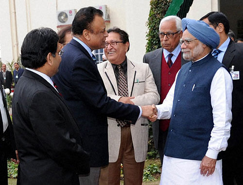 Prime Minister Manmohan Singh and J&K Governor N.N.Vorha meet Scientists at the Raj Bhavan in Jammu on Sunday. PTI Photo