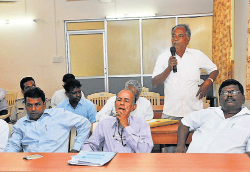 A Dalit community member speaks at the Scheduled Caste and Scheduled Tribe monthly grievance meeting at the Superintendent of Police office in Mangalore on Sunday. dh photo