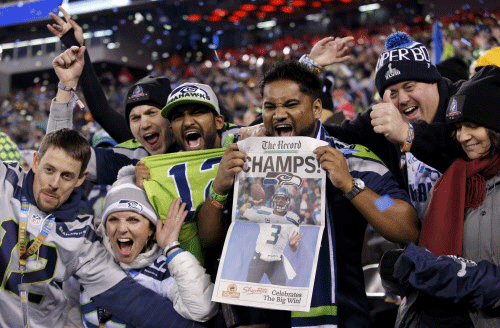 Seattle Seahawks fans celebrate after their team defeated the Denver Broncos in the NFL Super Bowl XLVIII football game in East Rutherford, New Jersey, February 2, 2014. REUTERS