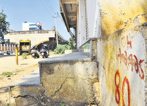 A building marked by the BDA for acquisition along the  Hennur Junction-Kacharakanahalli stretch for the  construction of Hennur flyover. dh photo