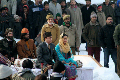 Bollywood actress Shraddha Kapoor along others artists at the shooting of her upcoming film 'Haider' in Anantnag district . PTI photo
