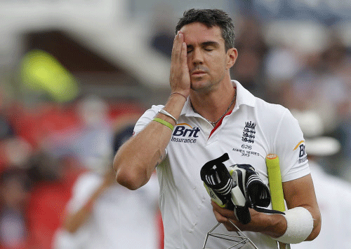 File photo of England's Pietersen walking off the pitch after being dismissed in Manchester. Reuters