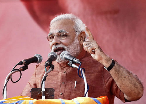 BJP's prime ministerial candidate Narendra Modi Wednesday accused the Congress and the Gandhi family of denying the coveted post of prime minister to Pranab Mukherjee twice - in 1984 and 2004 - despite his qualifications. Reuters File Photo
