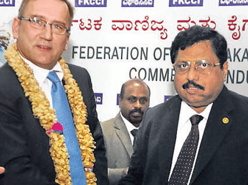 Minister of Economic Affairs of Estonia Juhan Parts (left), who is leading an Estonian business delegation to India, is welcomed by FKCCI President R Shivakumar in Bangalore on Wednesday. DH PHOTO