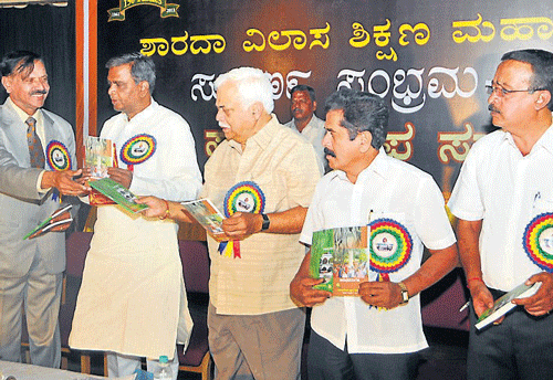 time to celebrate: Higher Education Minister R&#8200;V&#8200;Deshpande releases a souvenir of Sarada Vilas Institutions, in Mysore, on Wednesday. MLA Vasu, president of the institutions B&#8200;V&#8200;Parthasarthi, Revenue Minister&#8200;V&#8200;Sreenivas Prasad, MLA&#8200;M&#8200;K&#8200;Somashekar, and secretary&#8200;T&#8200;S&#8200;Ravishankar are seen. DH Photo