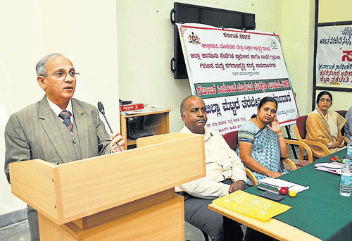 District Sessions Judge V G Sawadakar speaks during the inaugural function of an awareness workshop against domestic violence, in Chamarajanagar, on Wednesday. DH Photo