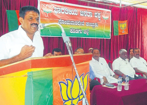 MLA Appachchu Ranjan speaks at the BJP workers meet                    in Somwarpet on Wednesday.