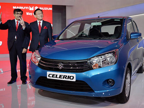 Mayank Pareek (L), COO Maruti Suzuki unveiled the Celerio hatchback at the Auto Expo 2014 in Greater Noida on Thursday. PTI Photo