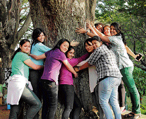caring: Kavitha (in green trousers) with other students in Cubbon Park.