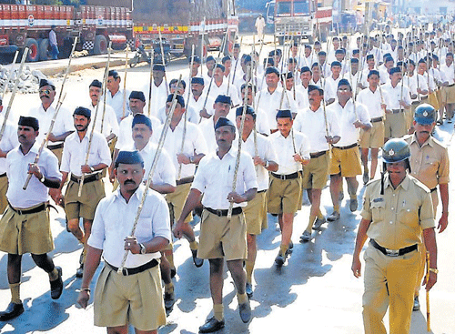 RSS workers march past in Chikmagalur city on Thursday.
