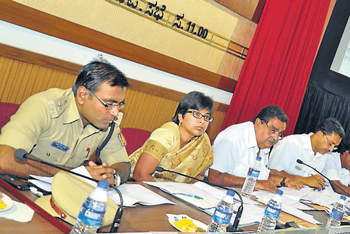 District-in-Charge Minister B Ramanath Rai chairs the tri-monthly district KDP meeting at    Zilla Panchayat hall on Thursday. ZP President Koragappa Naik, CEO Tulasi Maddineni, Deputy Commissioner A B Ibrahim and others look on. dh photo