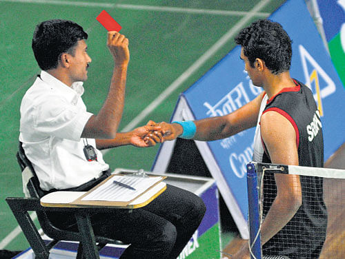 It's red for you! Anup Sridhar (right) receives a red card from the referee for smashing his racquet after his semifinal in Bangalore on Saturday. DH PHOTO