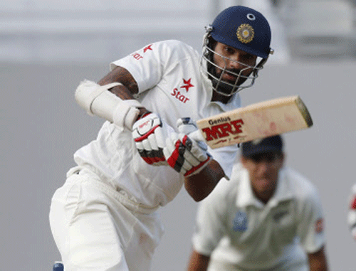 Shikhar Dhawan plays a shot during his second innings on day three of the first international test cricket match against New Zealand at Eden Park in Auckland February 8, 2014. REUTERS