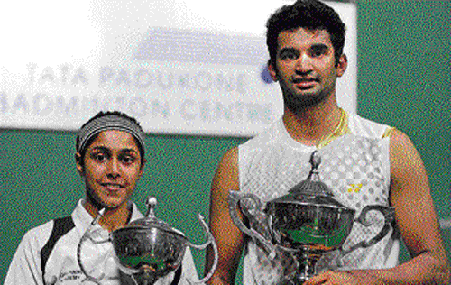 sweet moment Anup Sridhar (right) and Tanvi Lad with their spoils at the KBA courts on Saturday. DH photo