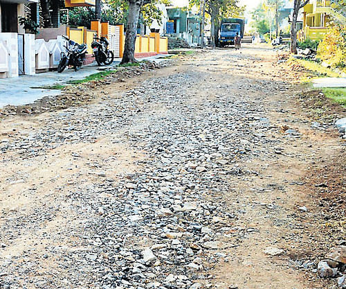 Sub-standard road works done under city development project, in Mandya. DH Photo