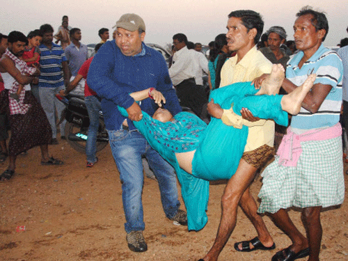 People rush a victim of drowned boat to a hospital in Sambalpur district of Odisha on Sunday. 11 persons have died in the mishap and many went missing after a boat carrying 90 people capsized on the Hirakud reservoir in Odisha. PTI Photo