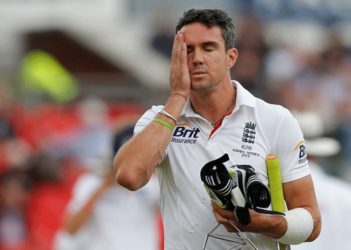 England's Kevin Pietersen walks off the pitch after being dismissed on the final day of the third Ashes test match at Old Trafford cricket ground in Manchester, northern England in this August 5, 2013 file photo. Pietersen's brilliant and controversial international career ended on February 4, 2014 as the fallout from England's woeful Ashes campaign claimed the scalp of one of the country's most mercurial batting talents. REUTERS