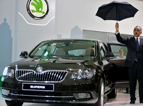 Sudhir Rao, Managing Director of Skoda Auto India, shows an umbrella which is fitted in the rear door panel in Skoda's newly unveiled Superb during the Indian Auto Expo in Greater Noida, on the outskirts of New Delhi February 5, 2014. REUTERS