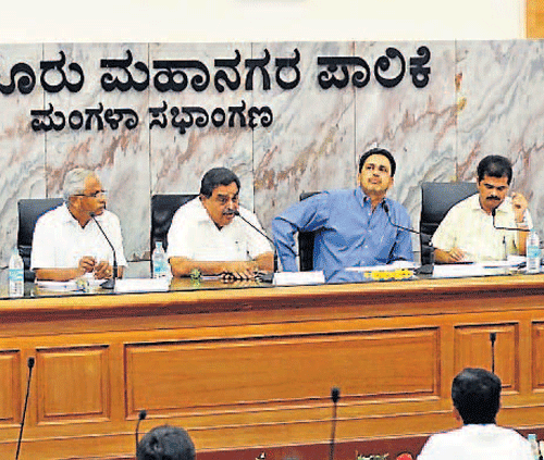 District-in-Charge Minister B Ramanath Rai at the review meeting of development works in Mangalore City Corporation limits at MCC hall on Monday. DH Photo