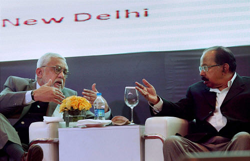 Union Petroleum Minister M Veerappa Moily with Petroleum Secretary Vivek Rae at the press conference at Petro Tech 2014 in Gretor Noida on Sunday.PTI Photo