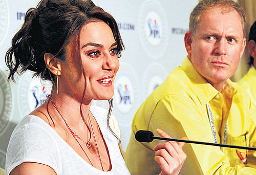 Kings XI Punjab co-owner Priety Zinta addresses the media as Sunrisers' Hyderabad's Tom Moody looks on in Bangalore on Wednesday. DH&#8200;photo