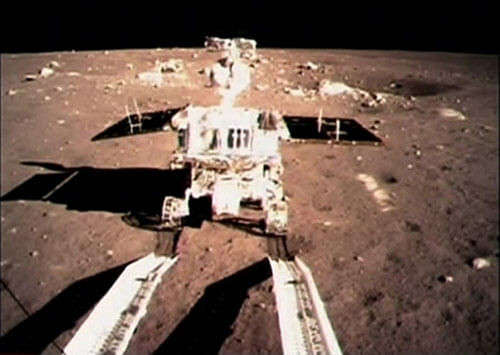FILE - In this Dec. 15, 2013 file photo taken by the on-board camera of the lunar probe Chang'e-3 and made off the screen of the Beijing Aerospace Control Center in Beijing, China's first moon rover 'Jade Rabbit' touches the lunar surface. (AP Photo/Xinhua)