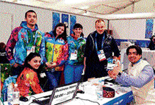 Welcome moment; Shiva Keshavan (left) gets his accreditation changed from Independent Olympic Participant to Indian athlete at the Winter Olympic Games in Sochi.