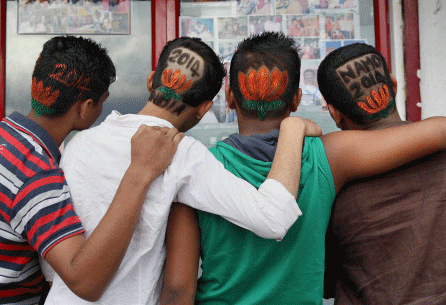BJP supporters sporting special hair-cuts to favour the party's campaign for Prime Ministerial candidate Narendra Modi in Mumbai on Thursday. PTI Photo