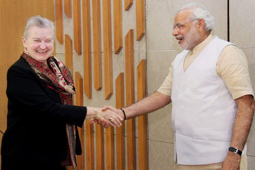 Gujarat Chief Minister Narendra Modi shakes hands with US ambassador to India Nancy Powell  during a meeting  in Gandhinagar on Thursday. PTI