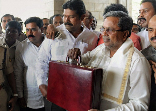 Karnataka Chief Minister Siddaramaiah arrives to present the budget in Vidhan Soudha in Bengaluru on Friday. PTI Photo