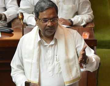 Chief Minister Siddaramaiah presenting the annual budget 2014-15 in the Vidhana Soudha in Bangalore on Friday. DH photo