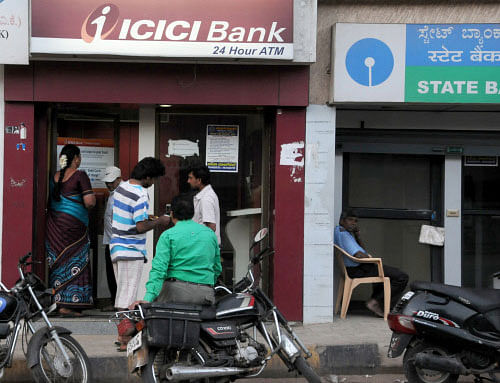 Despite security being tightened, two masked men broke into an ICICI Bank ATM kiosk. DH Photo