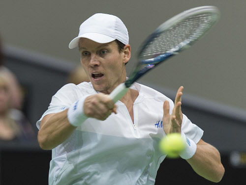 Tomas Berdych of Czech Republic hits a forehand against Marin Cilic of Croatia during their final match of the ABN AMRO tennis tournament in Rotterdam February 16, 2014. REUTERS