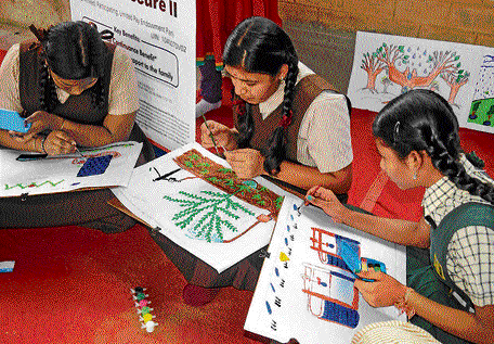 Children participate in 'Nanhe Chitrakar', a painting competition organised by Amway Opportunity Foundation in the City on Sunday. dh Photo