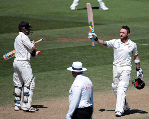 New Zealand's Brendon McCullum (R) acknowledges his 200 against India during the second innings on day four of the second international test cricket match at the Basin Reserve in Wellington, February 17, 2014. REUTERS
