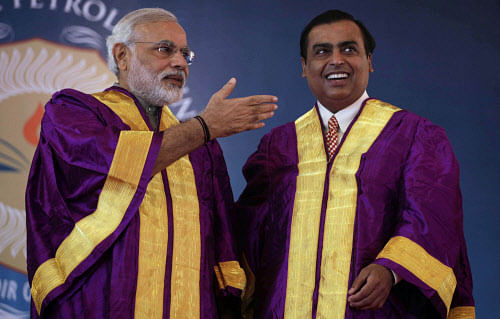 File photo of Gujarat state Chief Minister Narendra Modi with Chairman and Managing Director of Reliance Industries Limited Mukesh Ambani. AP