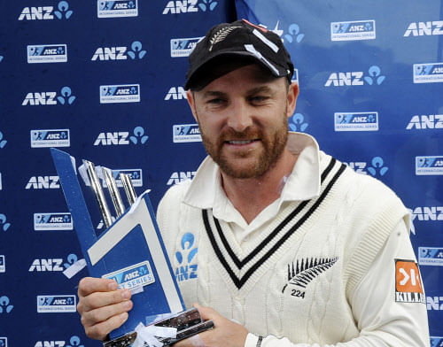 New Zealand's captain Brendon McCullum poses with the trophy after his teams series win over India on the final day of the second test at the Basin Reserve in Wellington, New Zealand, Tuesday, Feb. 18, 2014. AP Photo