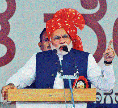 BJP's prime ministerial candidate Narendra Modi addresses a rally in Davangere on Tuesday.  DH Photo