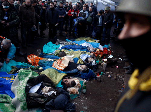 Bodies of anti-government protesters killed in clashes with police lay at the Independence Square in Kiev, Ukraine, Thursday, Feb. 20, 2014. Fearing that a call for a truce was a ruse, protesters tossed firebombs and advanced upon police lines Thursday in Ukraine's embattled capital. Government snipers shot back and the almost medieval melee that ensued left scores of people dead. AP Photo