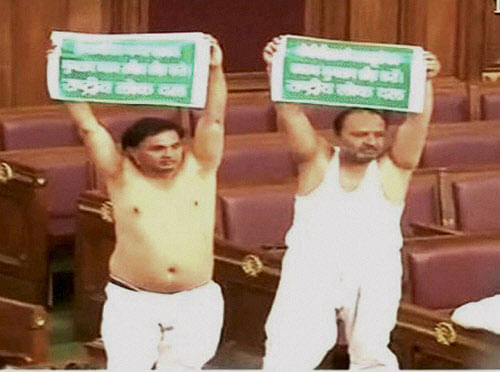 A woman legislator in Uttar Pradesh lodged a complaint with the speaker's office over two Rashtriya Lok Dal (RLD) legislators taking off their shirts in the assembly two days back, officials said Friday. PTI File Photo