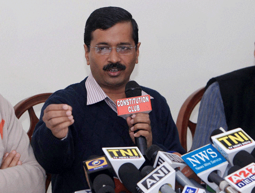 AP leader Arvind Kejriwal addresses a press conference in New Delhi on Friday. Training his guns on BJP's Prime Ministerial candidate again over the Reliance gas issue, the Aam Aadmi Party (AAP) today asked Narendra Modi whether he will bring down the gas price if he comes to power. PTI