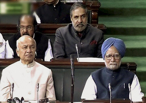 Prime Minister Manmohan Singh and Home Minister Sushilkumar Shinde on the last day of the winter session of the 15th Lok Sabha, in New Delhi on Friday. PTI Photo
