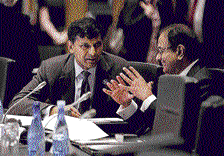 Reserve Bank of India Governor Raghuram Rajan speaks with Union Finance Minister P Chidambaram during the opening session of the G20 Finance Ministers and Central Bank Governors meeting in Sydney on Saturday. AP