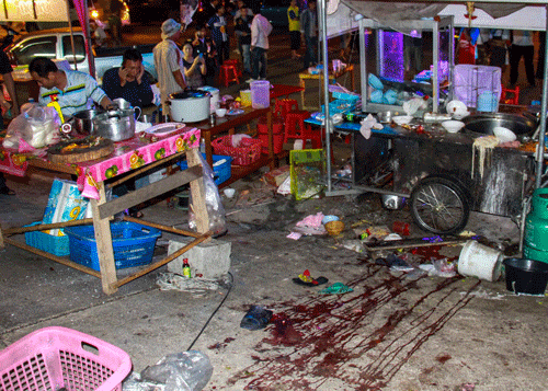 Blood stains are seen at the scene where an explosion took place near the anti-government protest site at Khao Saming district, in Trat province February 22, 2014. Supporters of Thai Prime Minister Yingluck Shinawatra promised on Sunday to get tough with anti-government protesters paralysing parts of Bangkok, raising tension in a protracted crisis hours after a deadly attack on a protest rally. REUTERS
