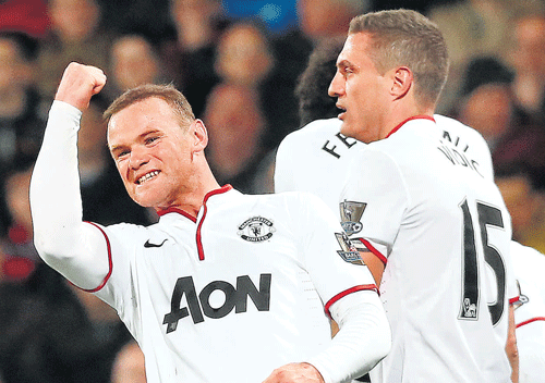 Manchester United's Wayne Rooney (left) celebrates after scoring against Crystal Palace in their English Premier League match at London on Saturday. Reuters