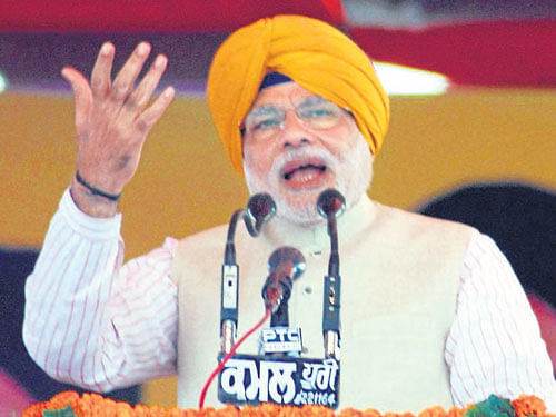 BJP's prime ministerial candidate Narendra Modi addresses a joint rally of SAD and BJP in Jagraon, Punjab, on Sunday. PTI