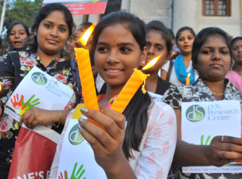 Students and members of D S Research centre candle light march against Cancer in front of Townhall in Bangalore on Tuesday. Cancer survivors seek better support system in the country.  Photo by B K Janardhan