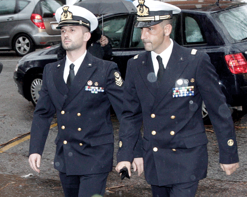 In this March 20, 2013 file photo Italian marines Salvatore Girone, left, and Massimiliano Latorre, arrive at a military prosecutor's office in Rome. On Monday, Feb. 10, 2014, Italy strongly objected to India's decision to use a severe anti-piracy law to prosecute the two Italian marines who have been held since 2012 in the deaths of two Indian fishermen. AP