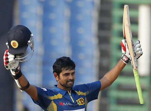Sri Lanka's Lahiru Thirimanne celebrates after scoring a century against Pakistan during their one-day international (ODI) cricket match at the 2014 Asia Cup in Fatullah February 25, 2014. REUTERS/Andrew Biraj